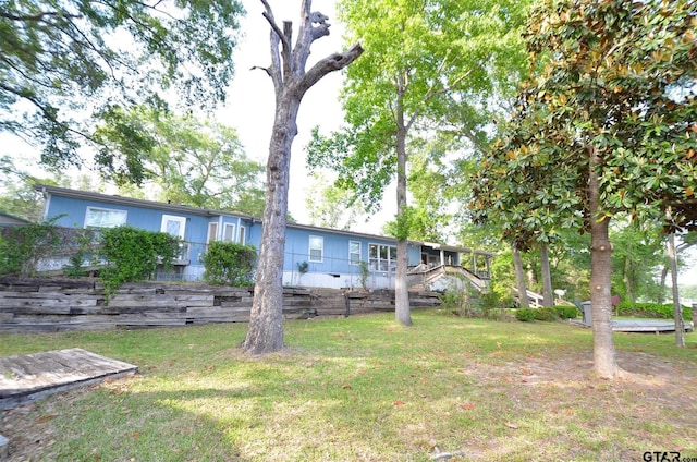 116 Piney Pt, Murchison, TX 75778 - rear view of property with a yard