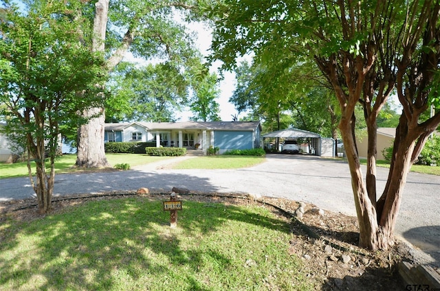 116 Piney Pt, Murchison, TX 75778 - view of front of property with a detached carport, a front yard, and asphalt driveway