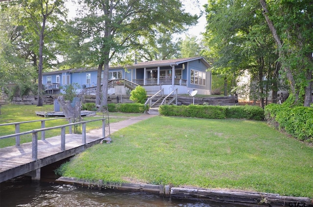 116 Piney Pt, Murchison, TX 75778 - back of house with stairs, a yard, and a deck with water view