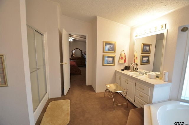 116 Piney Pt, Murchison, TX 75778 - ensuite bathroom featuring a stall shower, vanity, a textured ceiling, crown molding, and ceiling fan