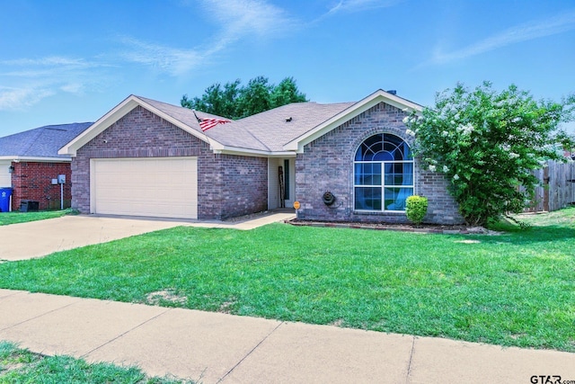 1112 E Park Dr, Lindale, TX 75771 - ranch-style house with an attached garage, a front lawn, concrete driveway, and brick siding