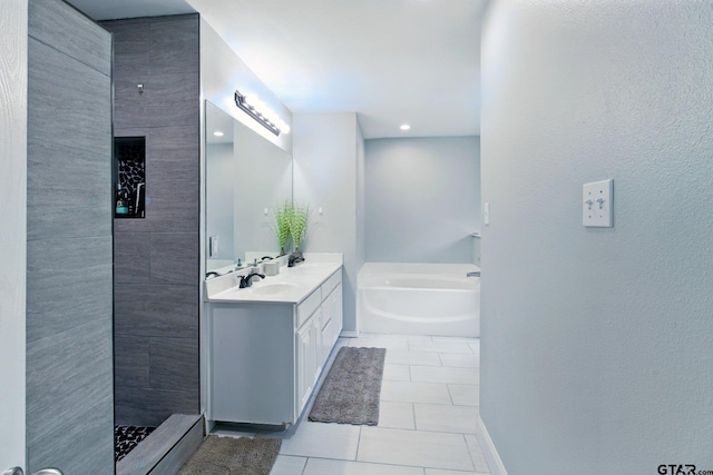 1112 E Park Dr, Lindale, TX 75771 - full bathroom featuring vanity, a garden tub, tile patterned floors, tiled shower, and baseboards