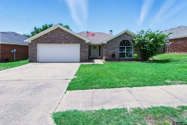 1112 E Park Dr, Lindale, TX 75771 - ranch-style home featuring a garage, concrete driveway, a front lawn, brick siding, and a chimney
