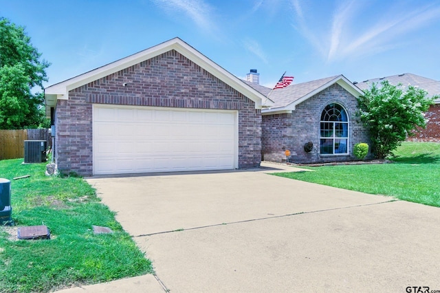 1112 E Park Dr, Lindale, TX 75771 - ranch-style home featuring a chimney, concrete driveway, central air condition unit, and brick siding