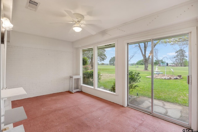 unfurnished sunroom featuring visible vents