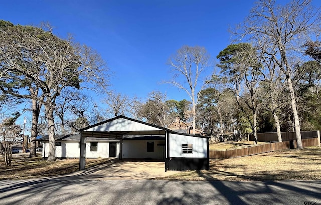 view of side of home featuring a carport