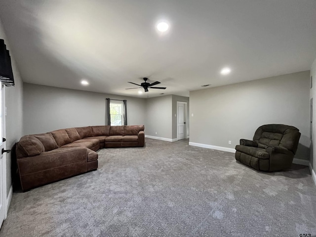 living room with ceiling fan and carpet