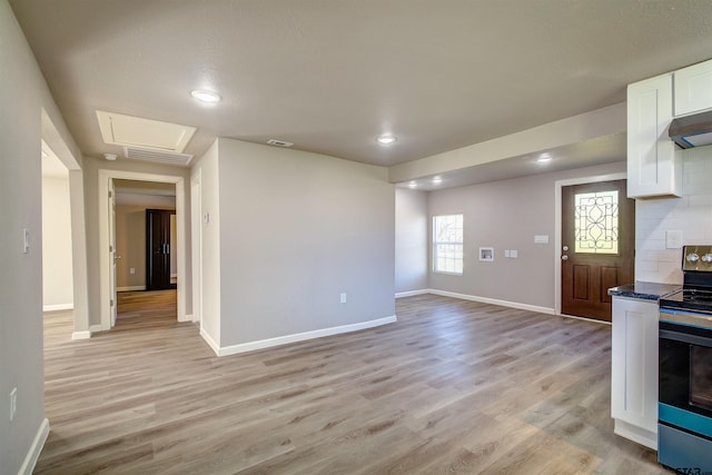 unfurnished living room with light hardwood / wood-style floors