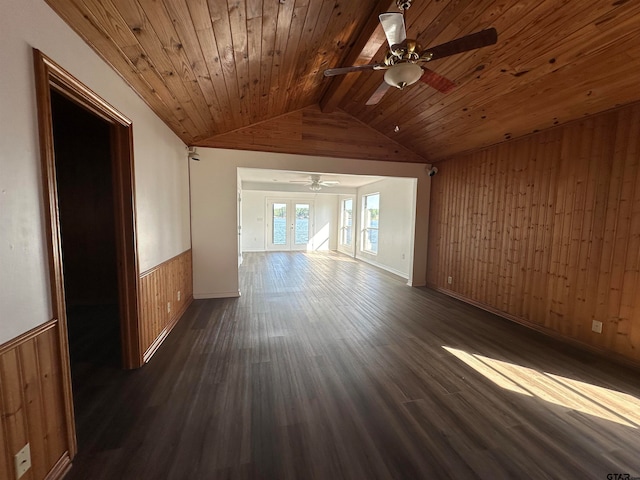 interior space featuring french doors, dark hardwood / wood-style flooring, vaulted ceiling with beams, wood walls, and wooden ceiling