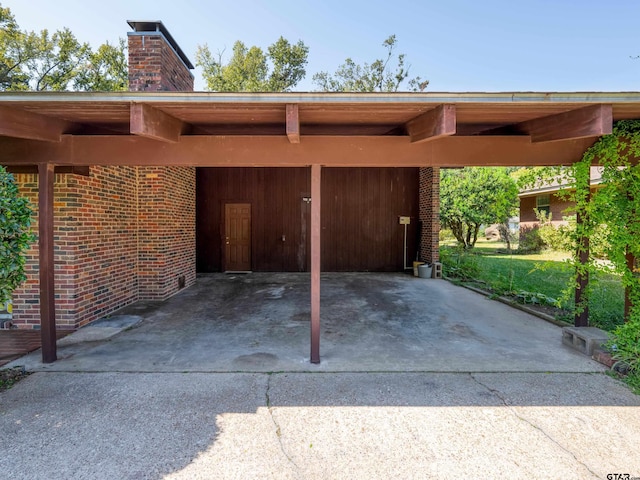 view of parking / parking lot with a carport