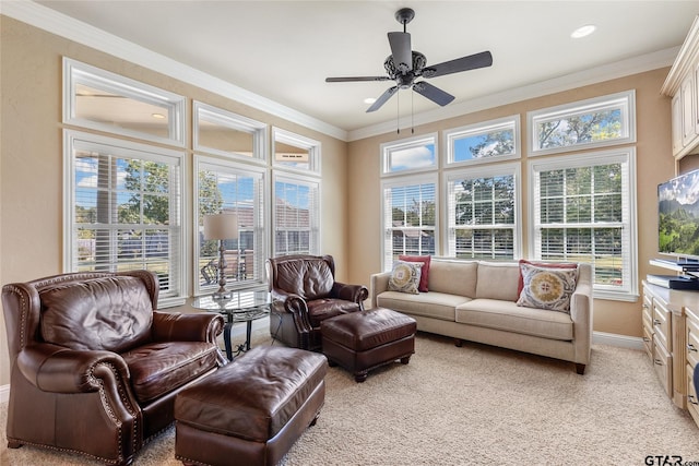 sunroom / solarium featuring ceiling fan