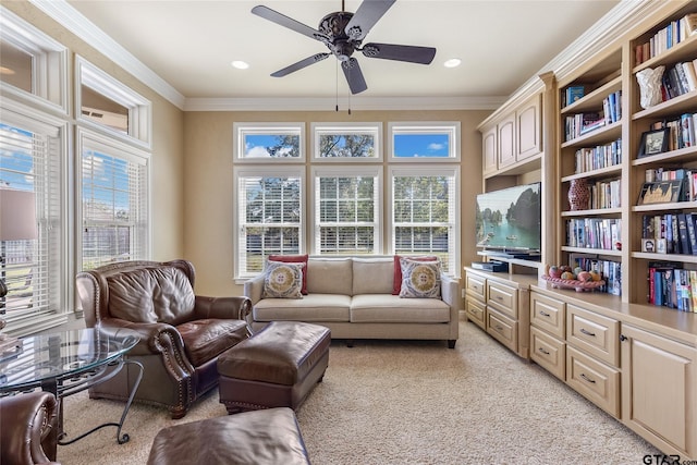 carpeted living room featuring ceiling fan, a wealth of natural light, and crown molding