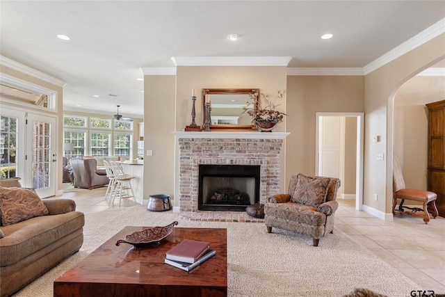 carpeted dining room featuring a brick fireplace and ornamental molding