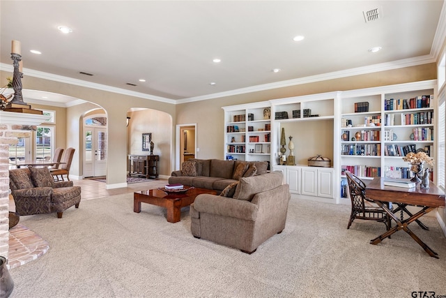 living room featuring a brick fireplace, light tile patterned floors, ornamental molding, and ceiling fan