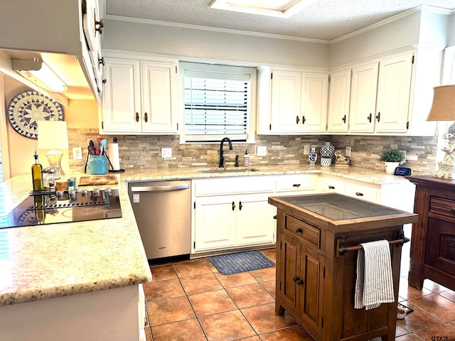 kitchen with stainless steel dishwasher, white cabinetry, sink, and black electric stovetop