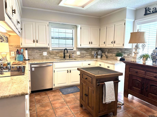 kitchen featuring dishwasher, black electric stovetop, white cabinets, and sink