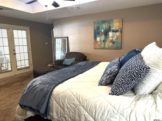 carpeted bedroom featuring a textured ceiling