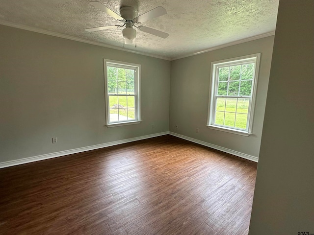 unfurnished room featuring dark wood-type flooring, ceiling fan, a textured ceiling, and crown molding