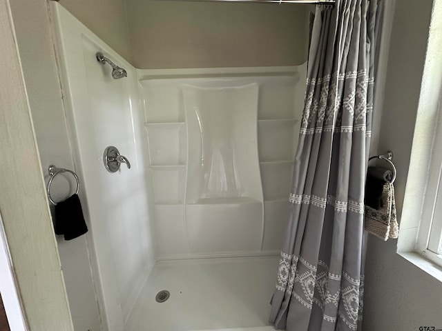 bathroom with a shower with shower curtain