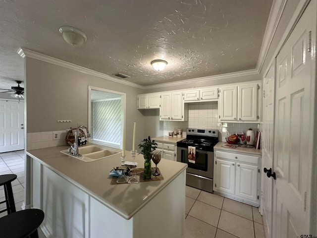 kitchen featuring white cabinetry, stainless steel range with electric stovetop, sink, and crown molding