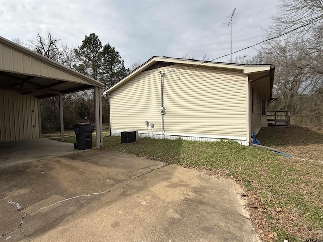 view of home's exterior with a carport