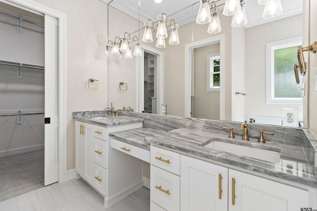 bathroom featuring vanity and crown molding