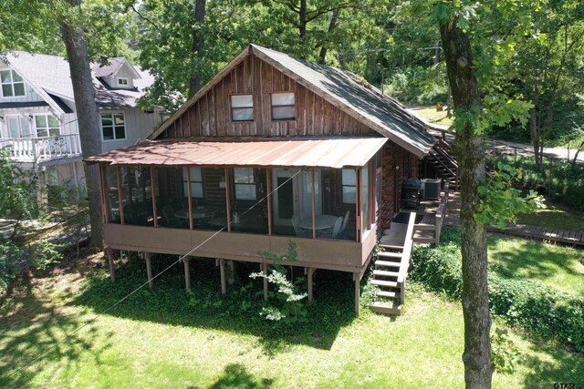 17044 Deer Run Dr, Bullard, TX 75757 - back of property featuring stairs, a sunroom, and a yard