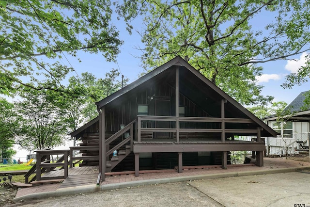 17044 Deer Run Dr, Bullard, TX 75757 - rear view of house featuring stairs, log siding, and a wooden deck