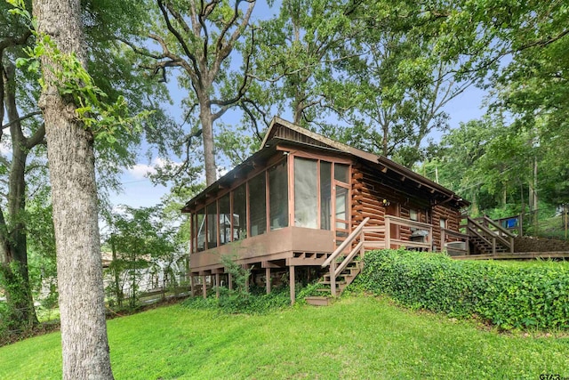 17044 Deer Run Dr, Bullard, TX 75757 - back of property featuring log siding, a sunroom, stairway, and a lawn