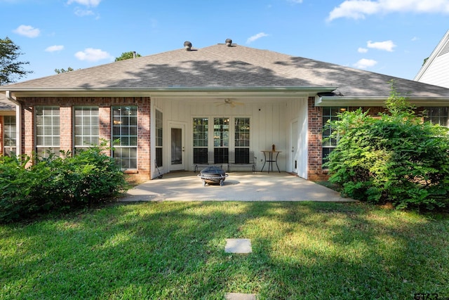 rear view of property with a patio, a lawn, and ceiling fan