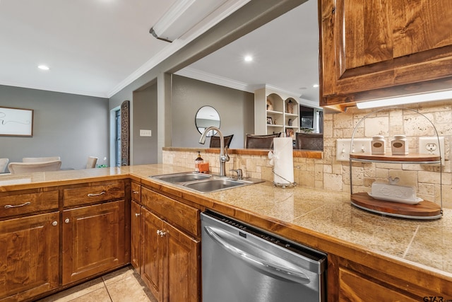 kitchen featuring light tile patterned flooring, sink, kitchen peninsula, ornamental molding, and dishwasher