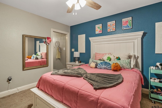 bedroom with ceiling fan and carpet