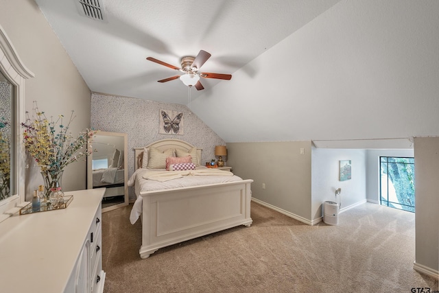 bedroom featuring ceiling fan, light carpet, and vaulted ceiling