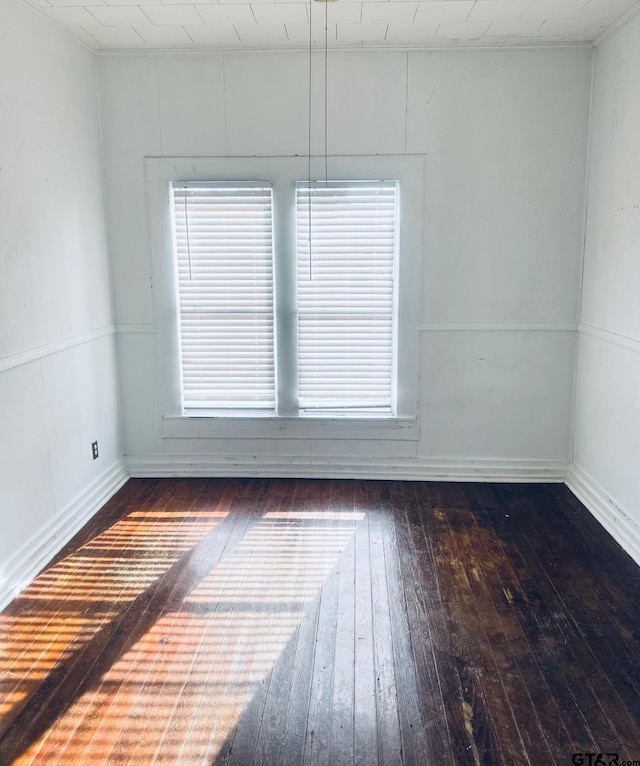 spare room featuring dark hardwood / wood-style flooring