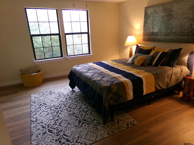 bedroom with wood-type flooring