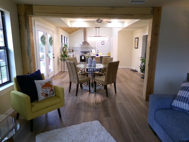 dining space with ceiling fan and hardwood / wood-style flooring