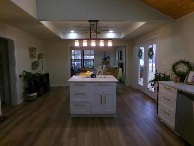 kitchen featuring white cabinetry, dishwasher, ceiling fan, and a healthy amount of sunlight