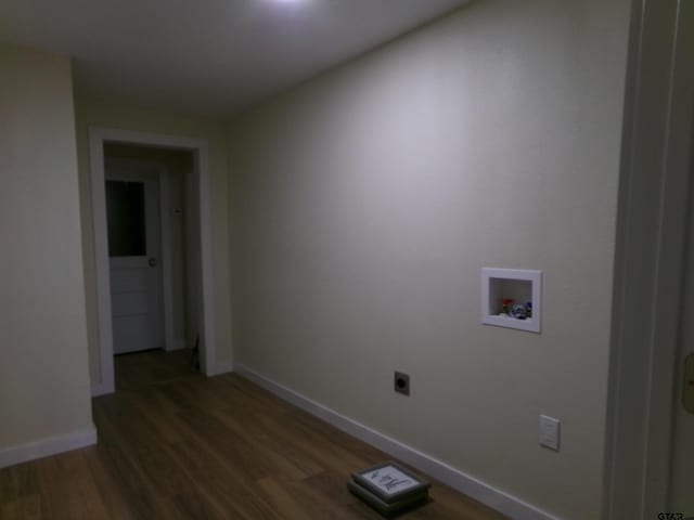 washroom with electric dryer hookup, hookup for a washing machine, and dark hardwood / wood-style floors