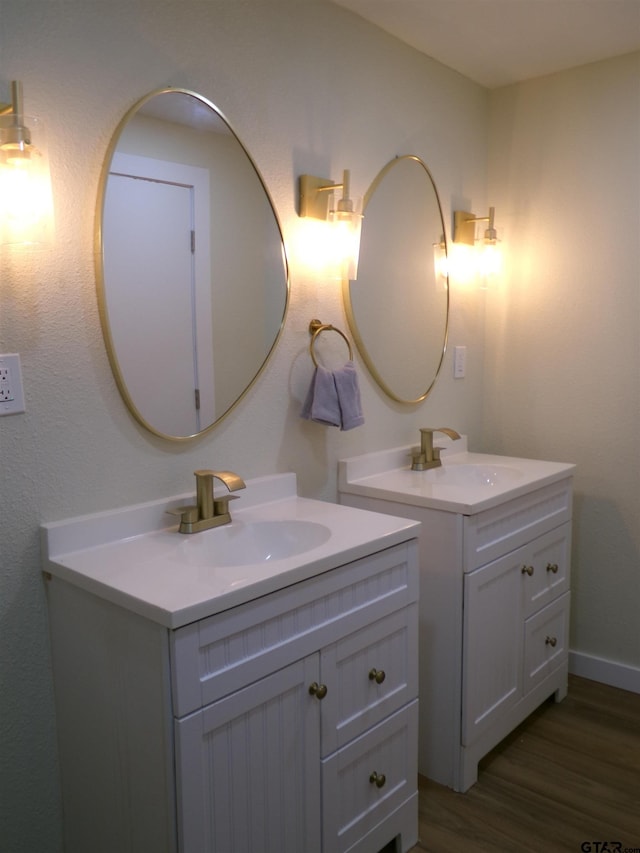 bathroom featuring hardwood / wood-style flooring and vanity