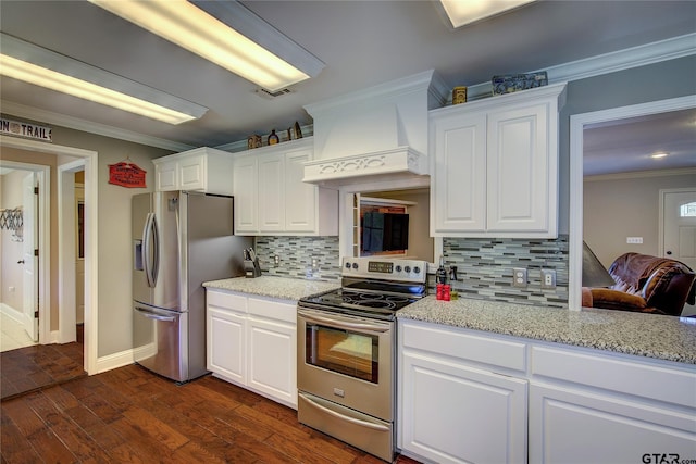 356 County Road 1439, Sulphur Springs, TX 75482 - kitchen featuring white cabinets, tasteful backsplash, custom exhaust hood, crown molding, and appliances with stainless steel finishes