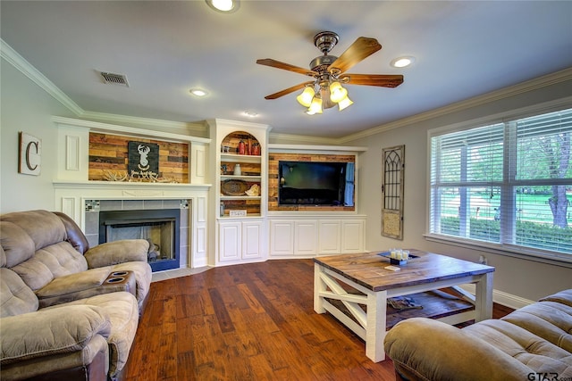 356 County Road 1439, Sulphur Springs, TX 75482 - living room with a tiled fireplace, visible vents, dark wood-style floors, and ornamental molding
