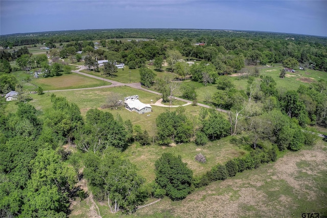 356 County Road 1439, Sulphur Springs, TX 75482 - birds eye view of property with a wooded view