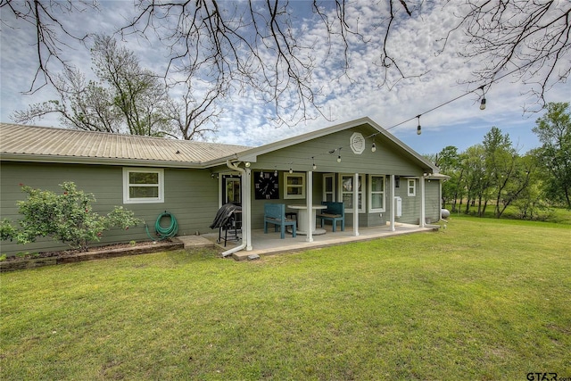 356 County Road 1439, Sulphur Springs, TX 75482 - back of property featuring covered porch, a lawn, and metal roof