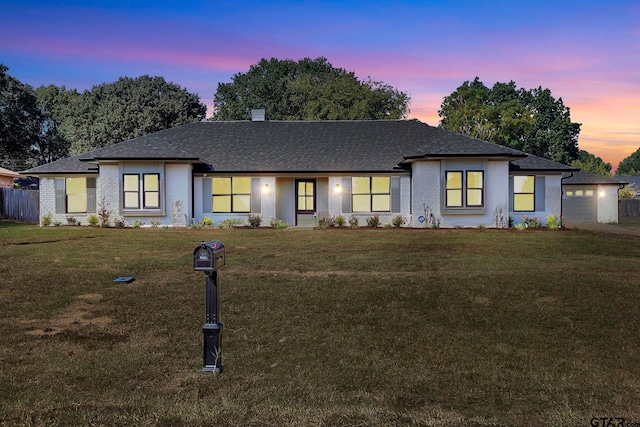 view of front of property with a yard