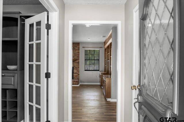 303 Westwood Dr, Troup, TX 75789 - hallway with dark wood-style flooring and baseboards