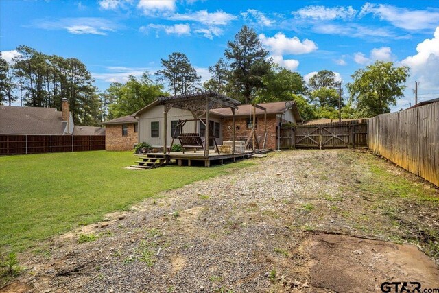 303 Westwood Dr, Troup, TX 75789 - back of house featuring a wooden deck, a pergola, and a gate