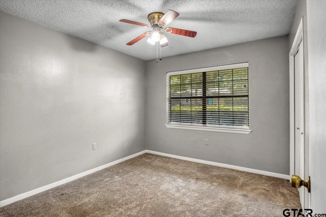 303 Westwood Dr, Troup, TX 75789 - spare room with carpet, ceiling fan, a textured ceiling, and baseboards