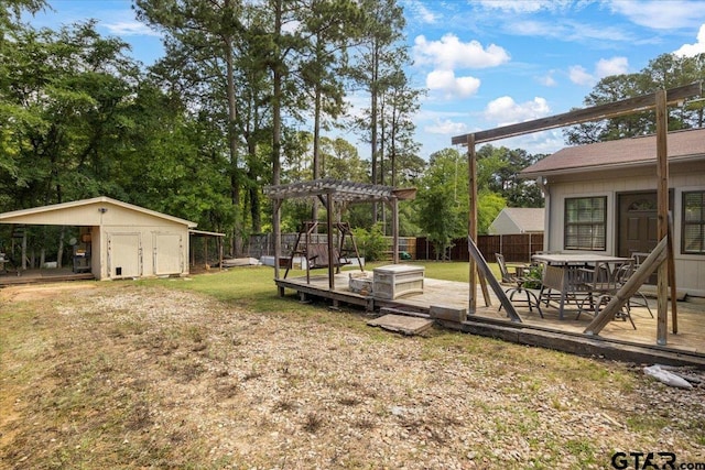 303 Westwood Dr, Troup, TX 75789 - view of yard with a wooden deck, a pergola, a storage shed, an outdoor structure, and view of scattered trees