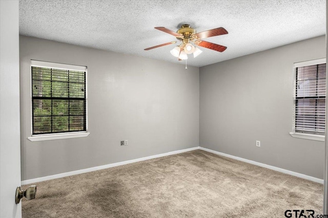 303 Westwood Dr, Troup, TX 75789 - carpeted spare room featuring ceiling fan, a textured ceiling, and baseboards