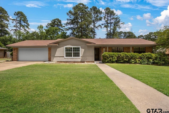 303 Westwood Dr, Troup, TX 75789 - single story home with a garage, a front lawn, brick siding, and driveway